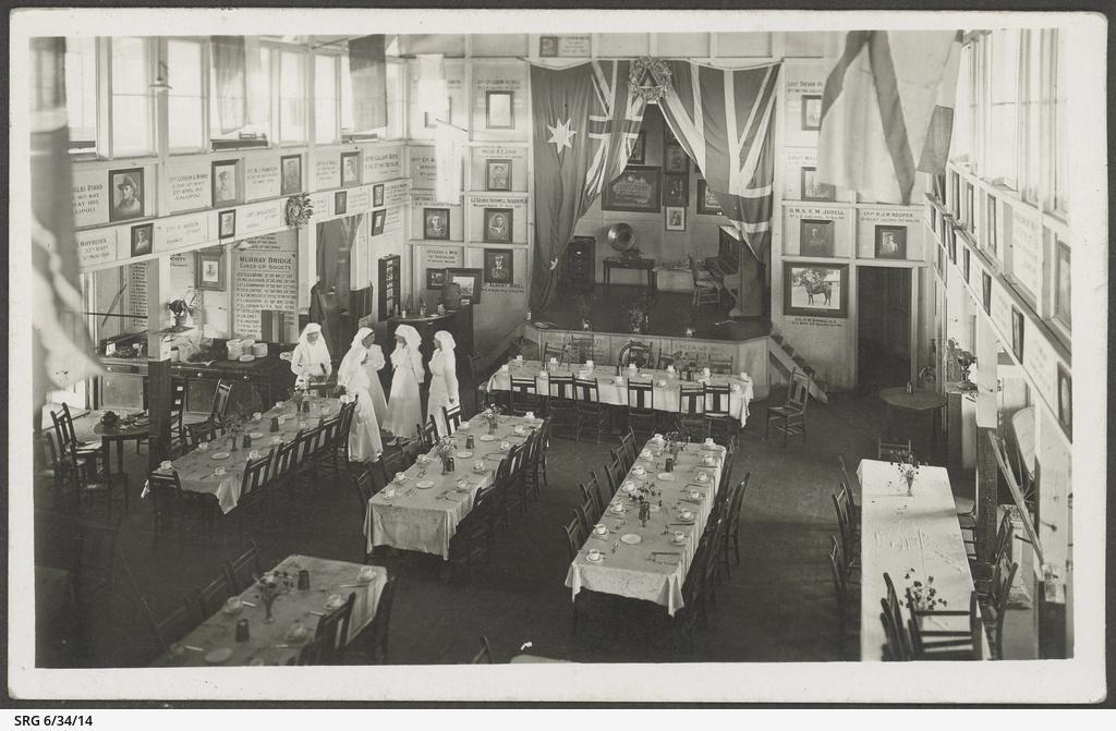 Interior of the Burra Hall set up for a dinner with five Cheer Up workers standing by. SLSA: SRG 6/34/14