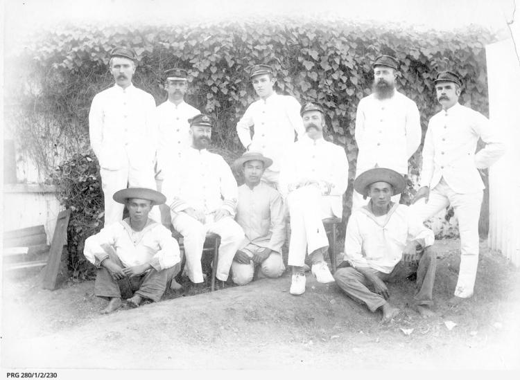 A group of Customs staff at Port Darwin in tropical uniform, with three Chinese men. SLSA: PRG 280/1/2/230 