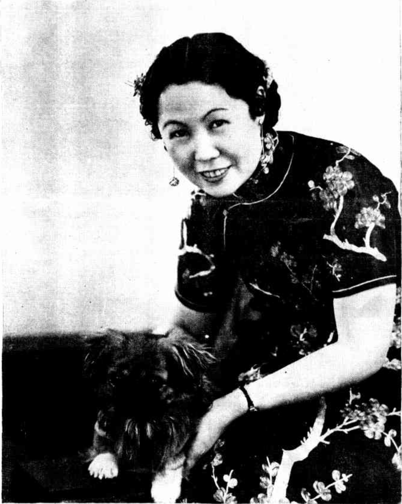 Miss Gladys Sym Choon with a Pekinese, The Examiner, 1937. NLA: Trove