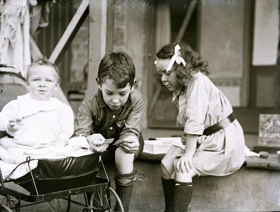 Brooker children on verandah, c 1907, showing baby Dorothy in stroller and May and William sitting on verandah-