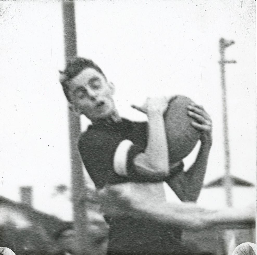 Footballer  caught in action marking the ball-c1920