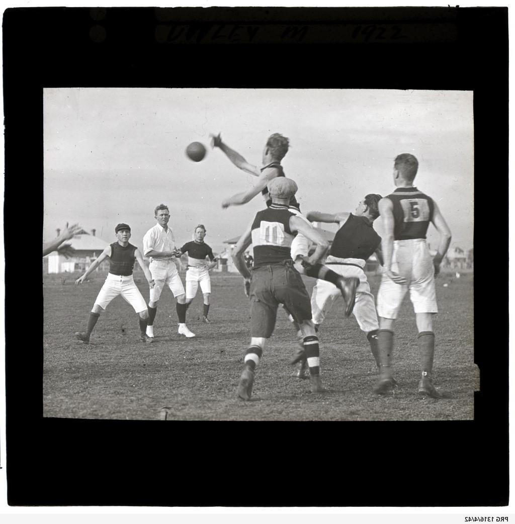 Football match, man leaping for football, possibly at oval in Unley