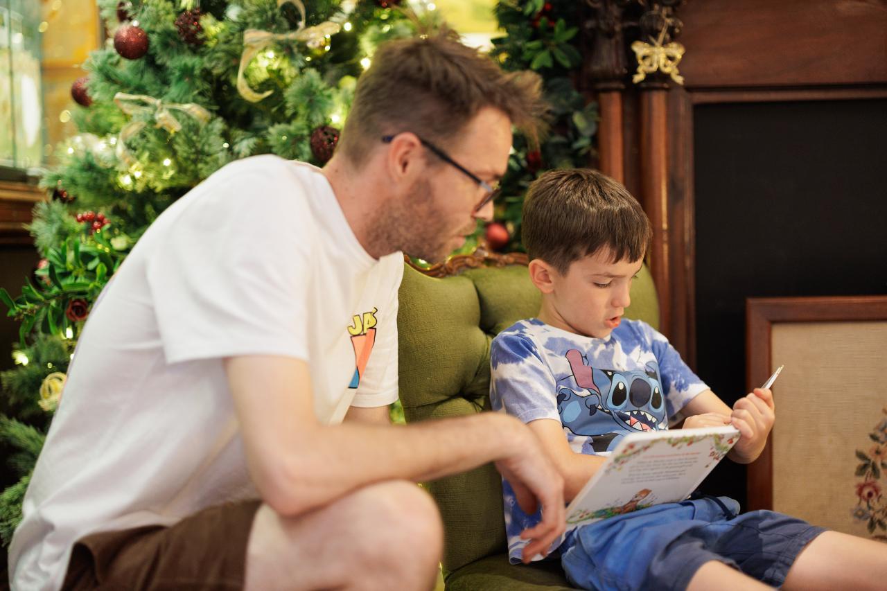 Father read a story to his son