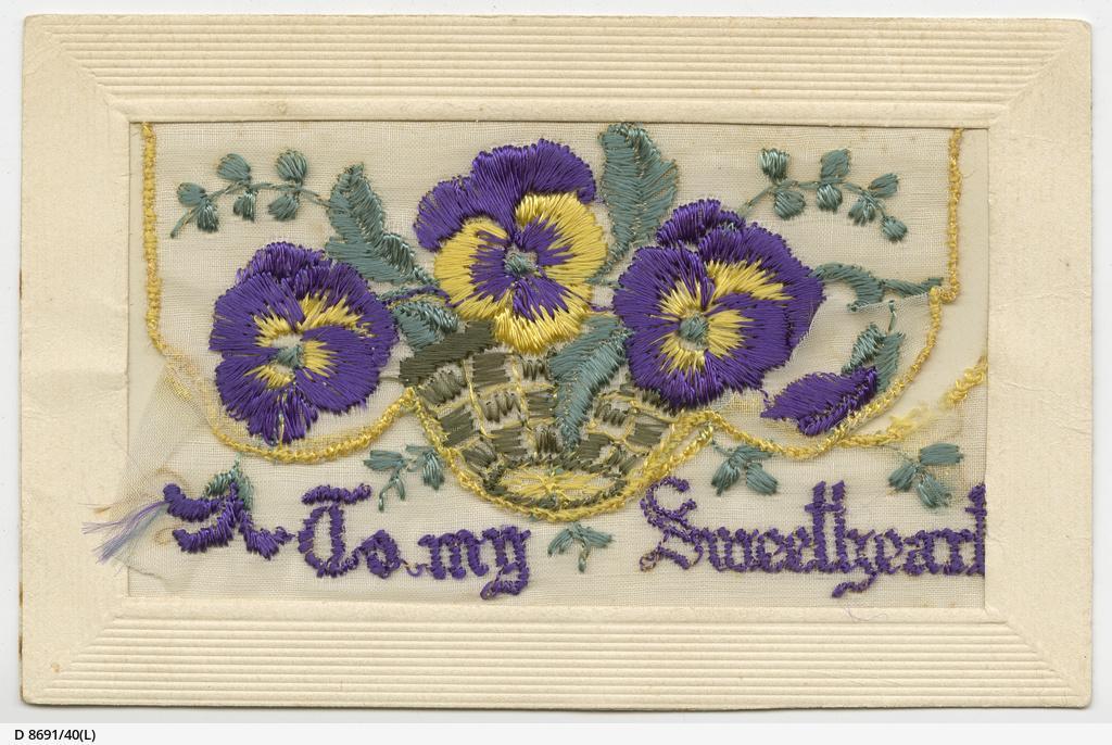 Silk-embroidered WW1 postcard of purple and yellow pansies and words 'To my sweetheart'  