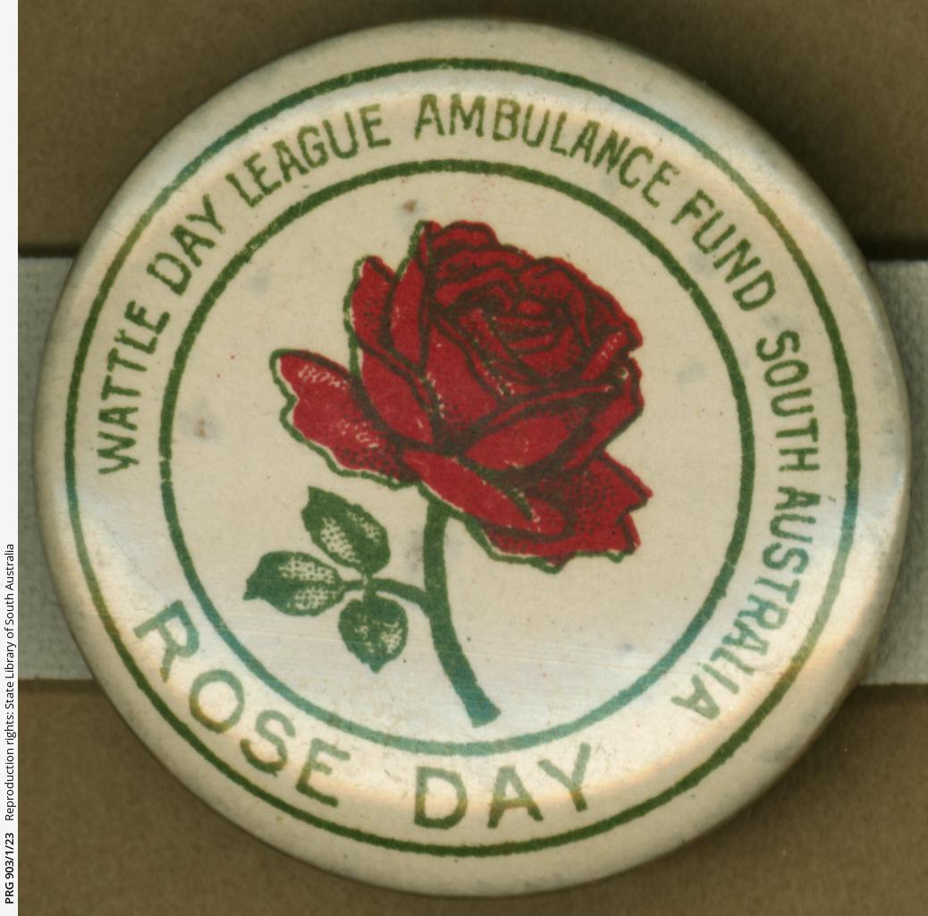 WW1 badge- Rose Day -showing dark red rose in full bloom