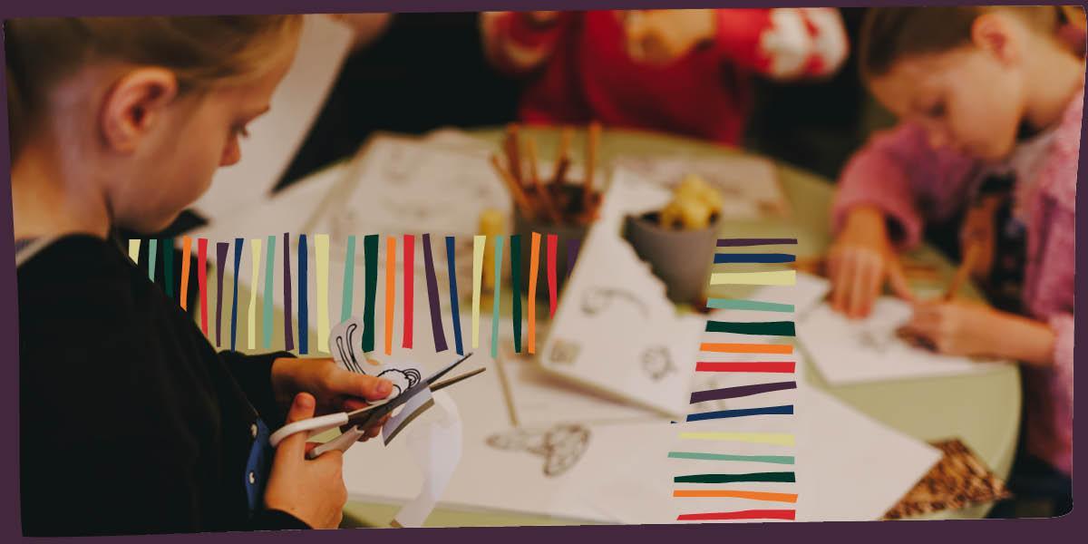 Children cutting paper and colouring in