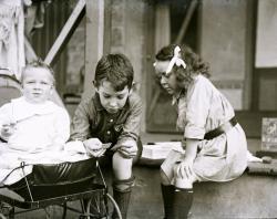 Brooker children on verandah, c 1907, showing baby Dorothy in stroller and May and William sitting on verandah-