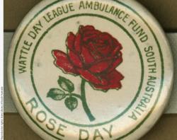 WW1 badge- Rose Day -showing dark red rose in full bloom