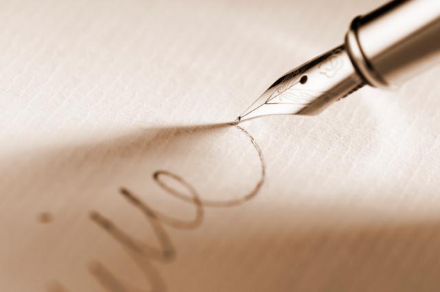 Bequests, Fountain pen writing on paper - iStock photo