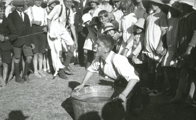 Boy ducking for apples at Sunday School picnic-Alberton Oval-c1926