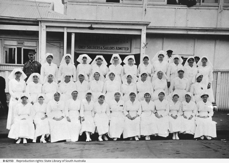 Group of Cheer-up  volunteers and military officer in front of the Cheer-up Hut, Adelaide 