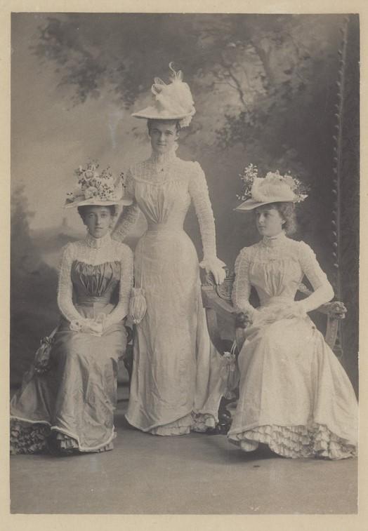 Three bridesmaids in front of a painted studio backdrop, c 1870. SLSA: B 50660